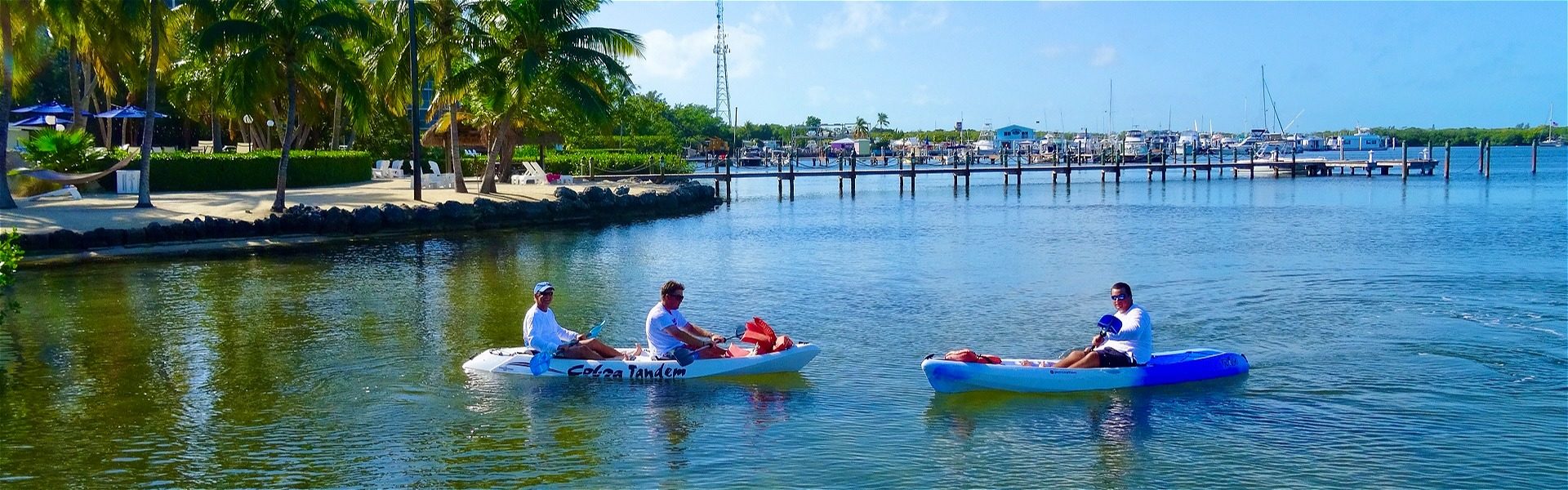 Guests enjoying complimentary kayaks in the bay
